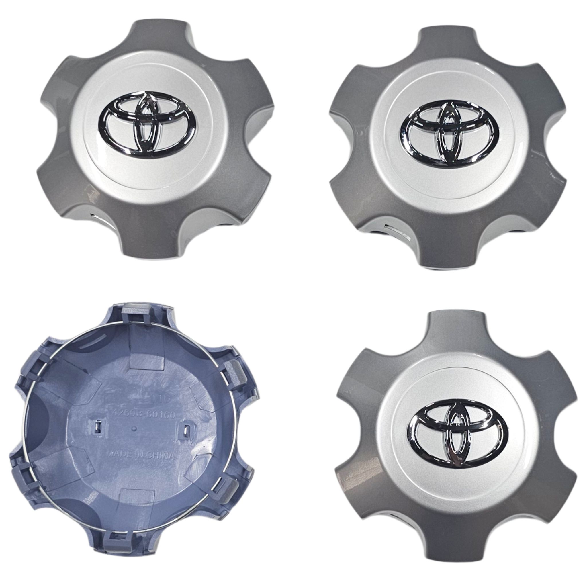 Toyota Landcruiser Prado Wheel centre hub set of 4 on white background one overturned